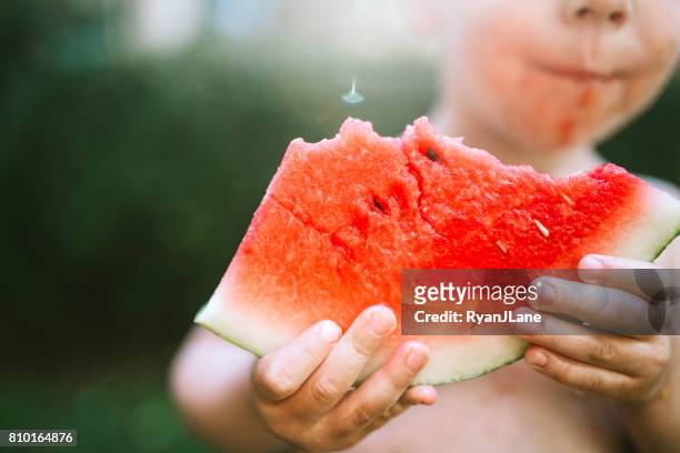 boy eating watermelon - child eating juicy stock pictures, royalty-free photos & images