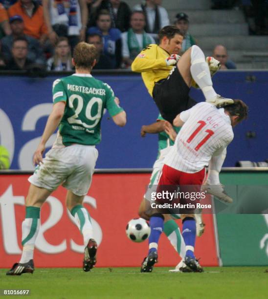 Tim Wiese goalkeeper of Bremen attacks Ivica Olic of Hamburg during the Bundesliga match between Hamburger SV and Werder Bremen at the HSH Nordbank...