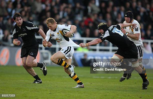 Josh Lewsey of Wasps is held back by Mark Sorenson of the Newcastle Falcons during the Guinness Premiership match between Newcastle Falcons and...