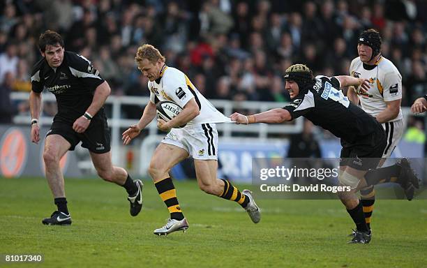 Josh Lewsey of Wasps is held back by Mark Sorenson of the Newcastle Falcons during the Guinness Premiership match between Newcastle Falcons and...