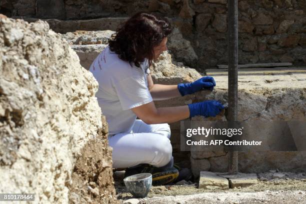 An archaeologist works in the Archaeological area of Santa Croce in Gerusalemme, in the new Domus Costantiniane, three belonging environments to the...