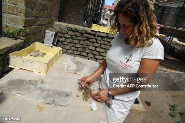 An archaeologist works in the Archaeological area of Santa Croce in Gerusalemme, in the new Domus Costantiniane, three belonging environments to the...