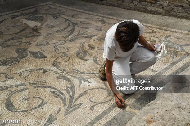 An archaeologist works in the Archaeological area of Santa Croce in Gerusalemme, in the new Domus Costantiniane, three belonging environments to the...