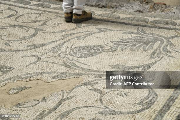 An archaeologist works in the Archaeological area of Santa Croce in Gerusalemme, in the new Domus Costantiniane, three belonging environments to the...