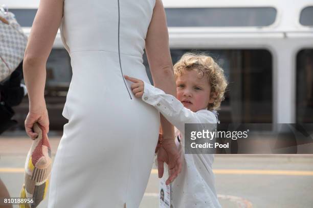 Sophie Gregoire, wife of Justin Trudeau, Prime Minister of Canada, holds her son Hadrien's hand as they leave the boat "Diplomat" on the river Elbe...