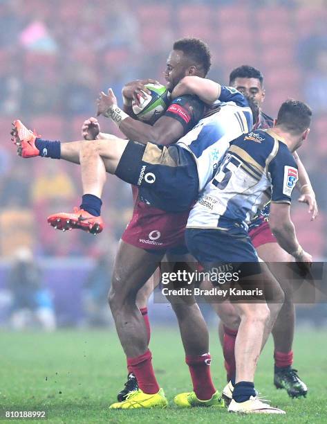 Eto Nabuli of the Reds is tackled during the round 16 Super Rugby match between the Reds and the Brumbies at Suncorp Stadium on July 7, 2017 in...