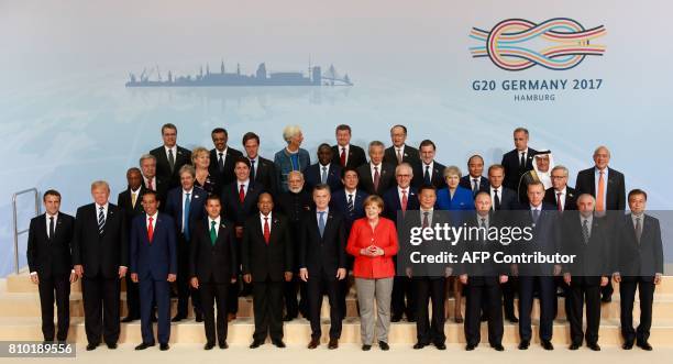 Participants of the G20 summit in Hamburg, northern Germany, pose for a family photo on July 7, 2017. Leaders of the world's top economies gather...