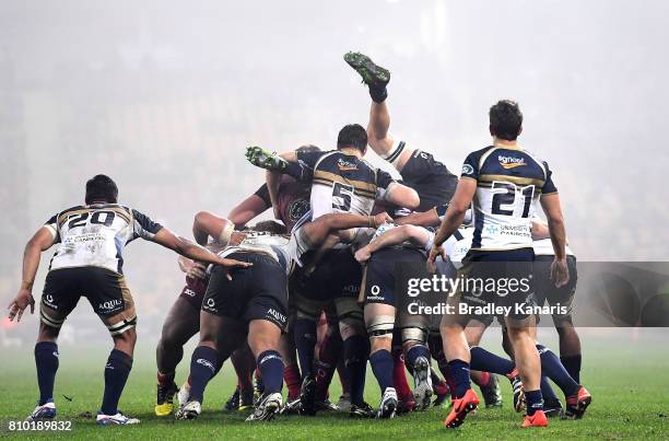 Players push in the scrum as a Brumbies player is turned upside down during the round 16 Super Rugby match between the Reds and the Brumbies at...