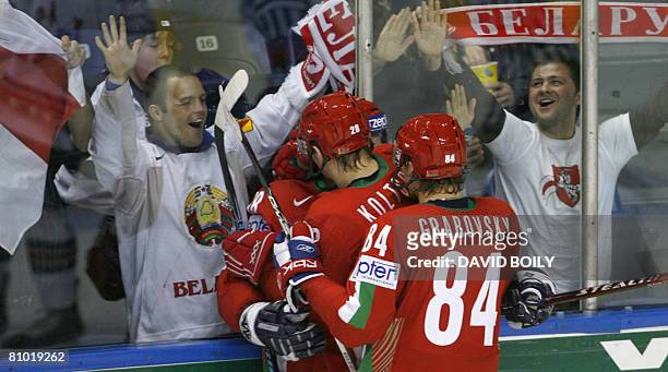 Alexei Ugarov of Belarus, Konstantin Koltsov and Mikhail Grabovsky of Belarus celebrate after Ugarov's goal, Belarus' second of the game during the...
