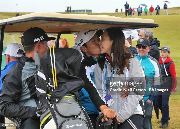 S Daniel Im kisses his wife after finishing his round during day two of the Dubai Duty Free Irish Open at Portstewart Golf Club.