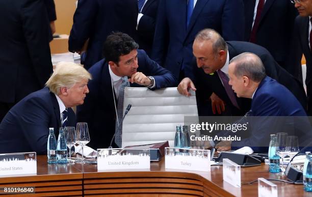 President of Turkey Recep Tayyip Erdogan talks with US President Donald Trump , accompanied by Foreign Affairs Minister of Turkey Mevlut Cavusoglu ,...