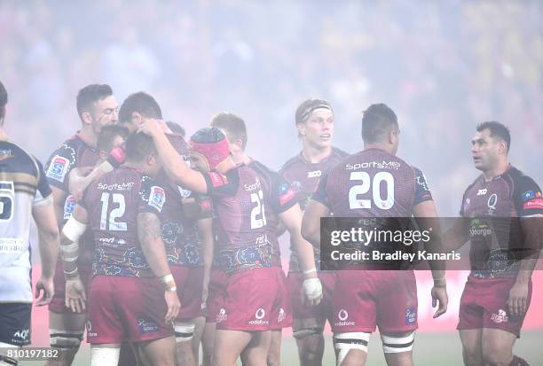 Reds players celebrate victory during the round 16 Super Rugby match between the Reds and the Brumbies at Suncorp Stadium on July 7, 2017 in...