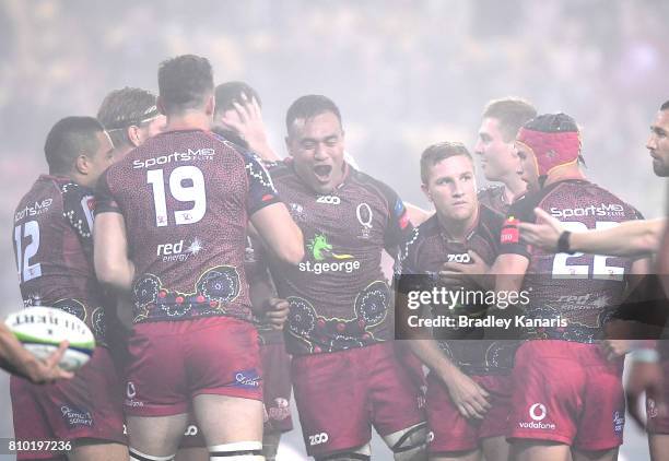 Reds players celebrate victory during the round 16 Super Rugby match between the Reds and the Brumbies at Suncorp Stadium on July 7, 2017 in...