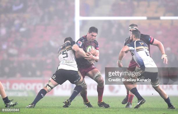 Rob Simmons of the Reds takes on the defence during the round 16 Super Rugby match between the Reds and the Brumbies at Suncorp Stadium on July 7,...