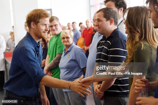 Prince Harry meets employees at the Haribo sweet factory on the second day of his visit to Leeds.