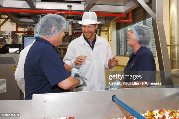 Prince Harry meets employees at the Haribo sweet factory on the second day of his visit to Leeds.