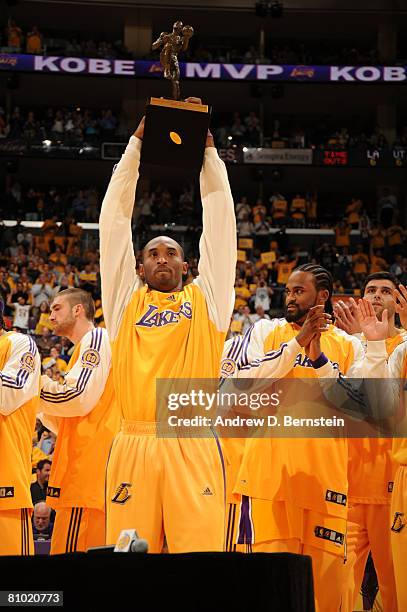 Kobe Bryant of the Los Angeles Lakers holds up the 2007-08 NBA Most Valuable Player award prior to taking on the Utah Jazz in Game Two of the Western...