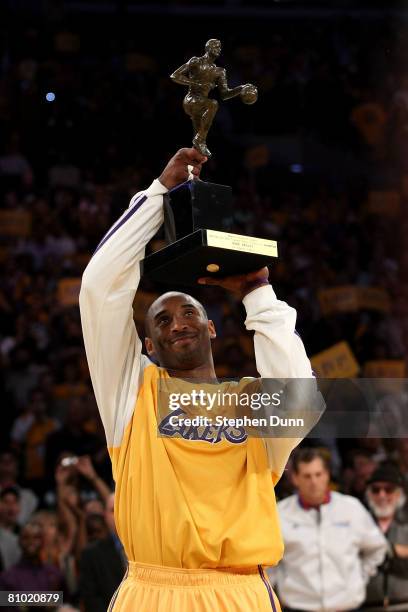 Kobe Bryant of the Los Angeles Lakers looks up at the MVP Trophy before the start of Game Two of the Western Conference Semifinals against the Utah...