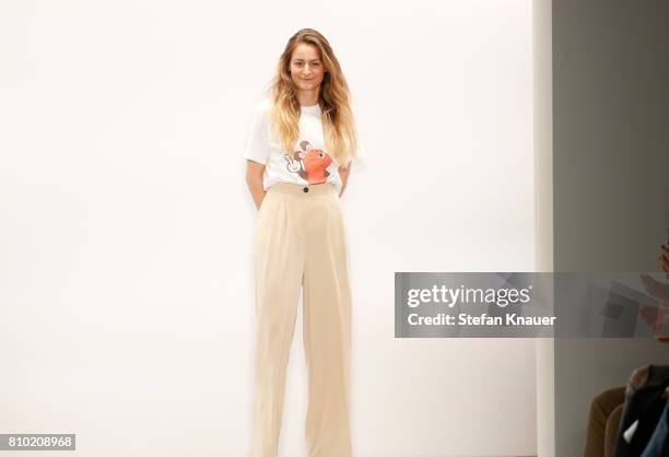 Designer Franziska Michael acknowledges the applause of the audience after her show during the Mercedes-Benz Fashion Week Berlin Spring/Summer 2018...