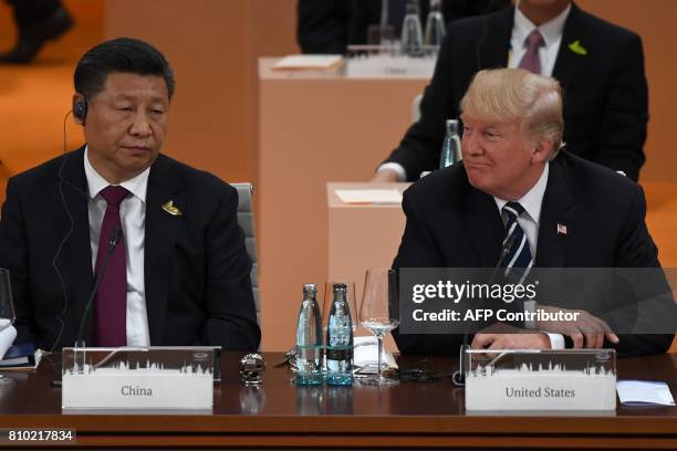 China's President Xi Jinping and US President Donald Trump attend a working session on the first day of the G20 summit in Hamburg, northern Germany,...