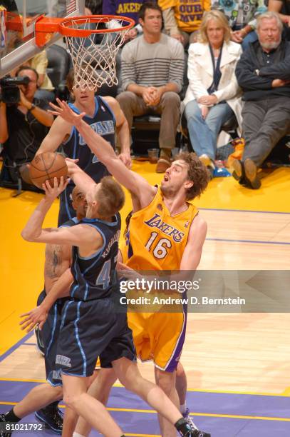 Pau Gasol of the Los Angeles Lakers challenges the shot of Andrei Kirilenko of the Utah Jazz in Game Two of the Western Conference Semifinals during...