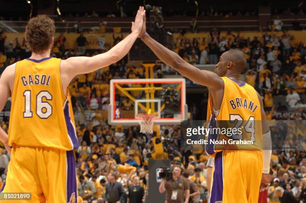 Pau Gasol and Kobe Bryant of the Los Angeles Lakers high-five each other following their victory over the Utah Jazz in Game Two of the Western...
