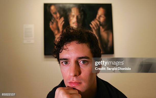 Artist Vincent Fantauzzo poses in front of his winning entry a portrait of the late actor Heather Ledger titled 'Heath' awarded as the winner of the...