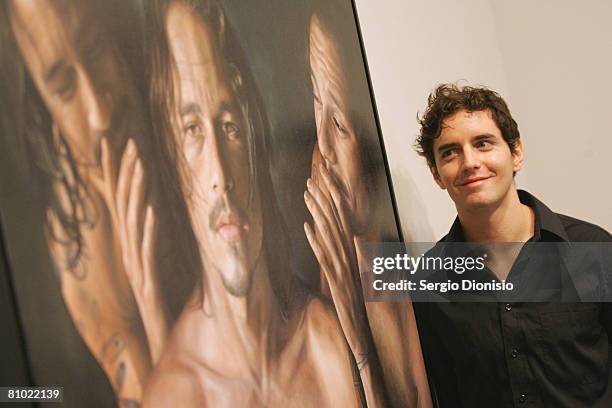 Artist Vincent Fantauzzo poses beside his winning entry a portrait of the late actor Heather Ledger titled 'Heath' awarded as the winner of the...