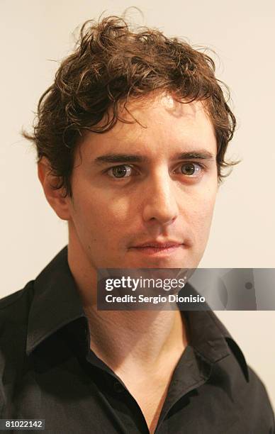 Artist Vincent Fantauzzo poses beside his winning entry a portrait of the late actor Heather Ledger titled 'Heath' awarded as the winner of the...