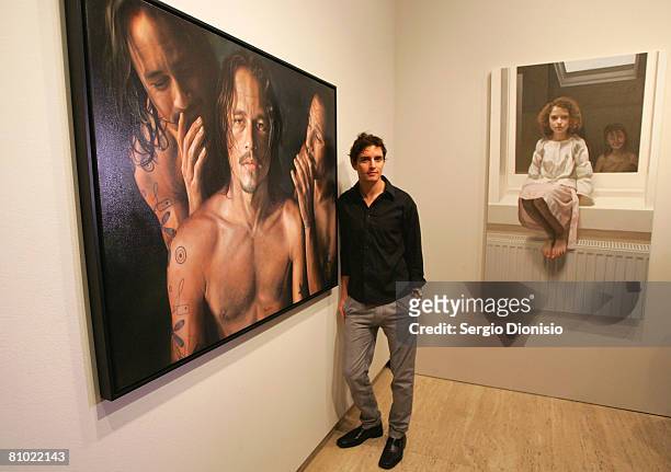 Artist Vincent Fantauzzo poses beside his winning entry a portrait of the late actor Heather Ledger titled 'Heath' awarded as the winner of the...