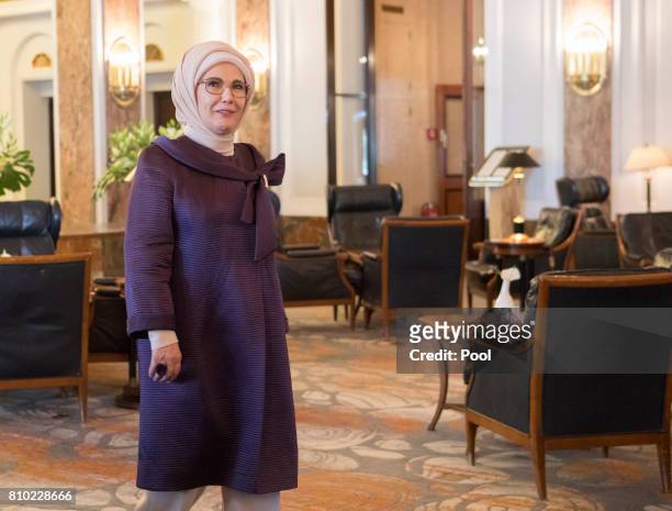 Emine Erdogan, wife of Recep Tayyip Erdogan, President of the Republic of Turkey, walks through the lobby of the Atlantic Hotel as she takes part in...