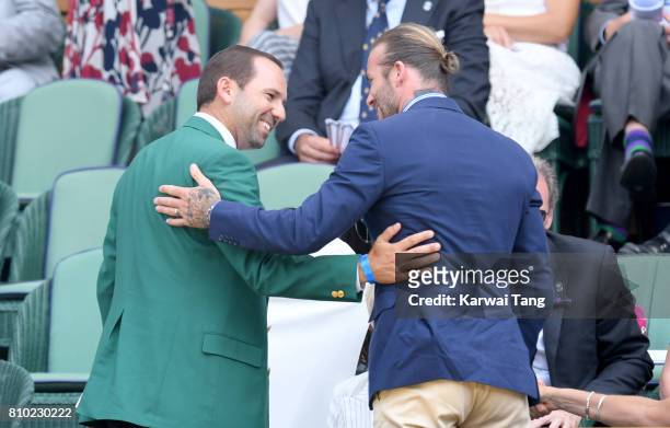 Sergio Garcia and David Beckham greet each other as they attend day 5 of Wimbledon 2017 on July 7, 2017 in London, England.