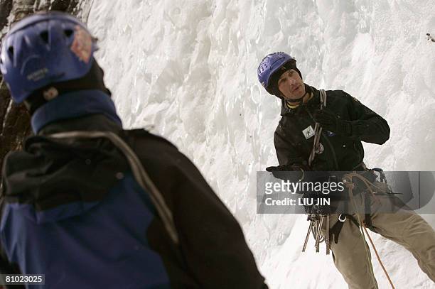 French climbing coach Olivier Balma instructs his members of the class for mountain guides at a training base at Siguniang mountain in China's...