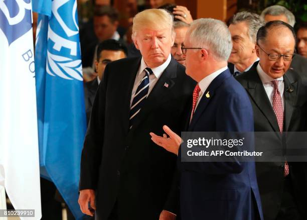 President Donald Trump and Australia's Prime Minister Malcolm Turnbull as the President of the World Bank Group Jim Yong Kim looks on after the...