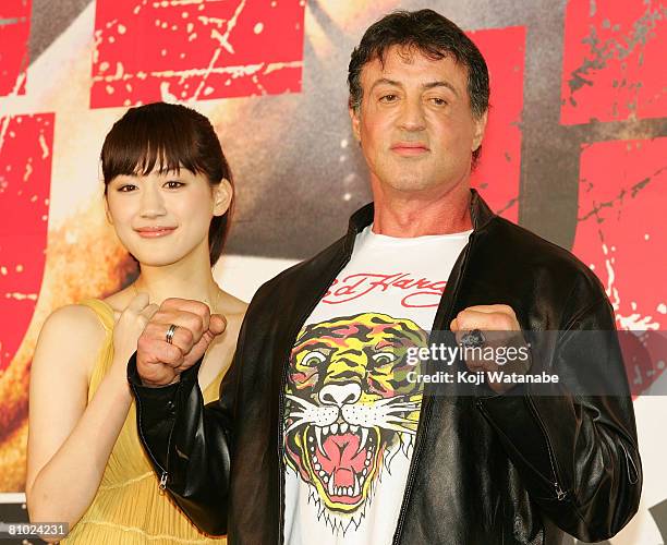Actor Sylvester Stallone and Japanese actress Haruka Ayase pose for photographs during "Rambo" Japan Premiere at Roppongi Hills on May 8, 2008 in...