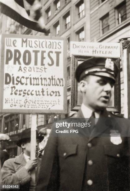 Musicians join a demonstration in New York City against the actions of new German Chancellor Adolf Hitler, 10th May 1933.