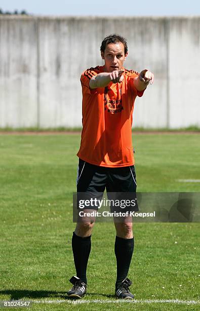 National coach Heiko Herrlich gives instructions to prisoners during a training session during the youth inmate football program of the German...