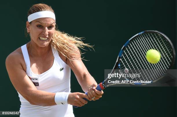 Slovakia's Dominika Cibulkova returns against Croatia's Ana Konjuh during their women's singles third round match on the fifth day of the 2017...