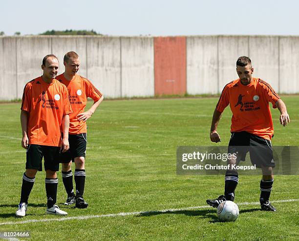 Prisoners in action during a training session during the youth inmate football program of the German Football Association at the prison on May 8,...