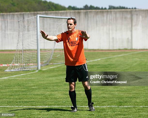 National coach Heiko Herrlich gives instructions to prisoners during a training session during the youth inmate football program of the German...