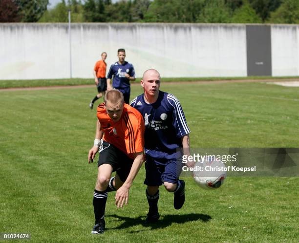 Two prisoner footballer in action during a friendly match during the youth inmate football program of the German Football Association at the prison...