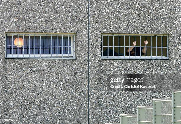 Prisoner stands at the grid at the JVA Iserlohn prison on May 8, 2008 in Iserlohn, Germany. German Football Association U18 national coach Heiko...