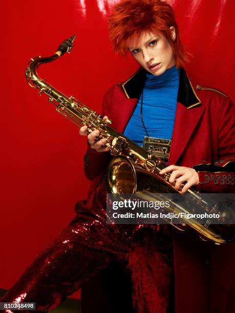 Model Alice Cornish poses as David Bowie at a fashion shoot for Madame Figaro on May 10, 2017 in Paris, France. Coat , top , pants , necklace ....