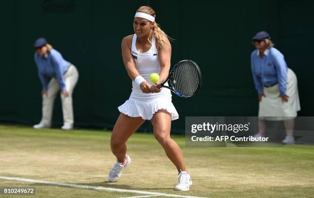 Slovakia's Dominika Cibulkova returns against Croatia's Ana Konjuh during their women's singles third round match on the fifth day of the 2017...