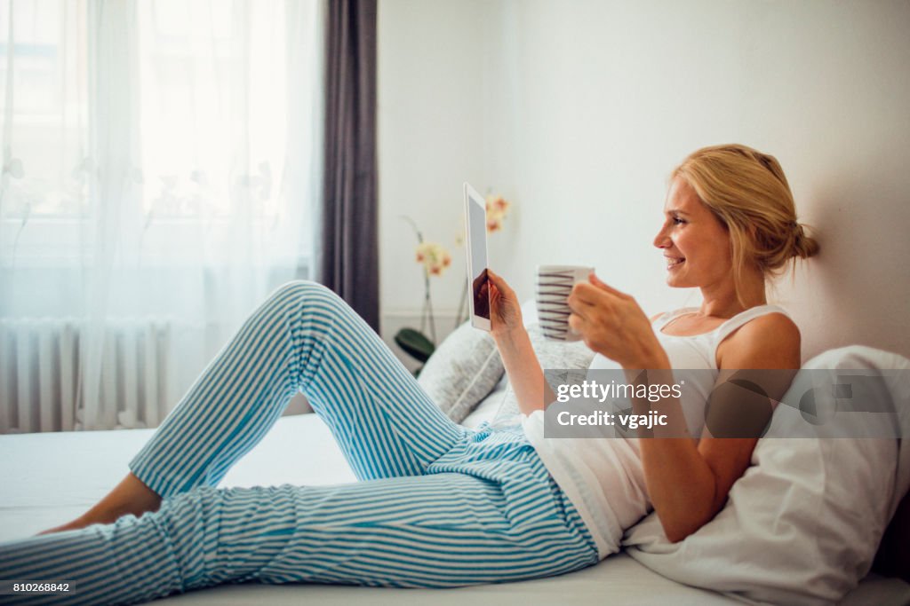 Mid adult woman laying in the bed