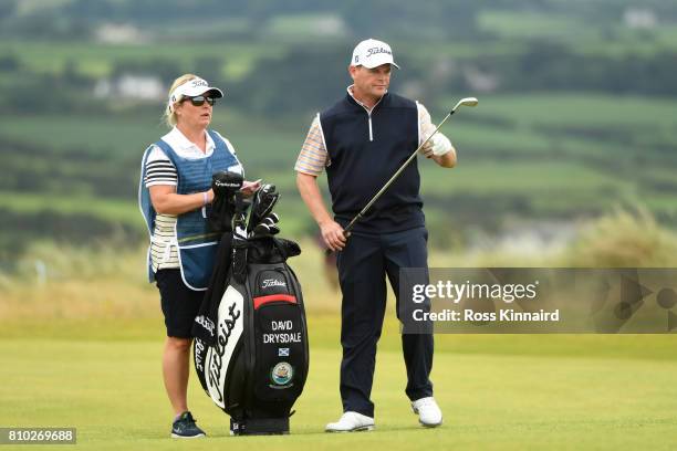 David Drysdale of Scotland and his wife/caddie Vicky look down the 18th hole during day two of the Dubai Duty Free Irish Open at Portstewart Golf...
