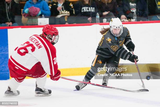 Melissa Sheeran of Plattsburgh State University defends Kristin Lewicki of Adrian College during the Division III Women's Ice Hockey Championship...