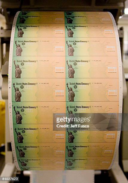 Economic stimulus checks are prepared for printing at the Philadelphia Financial Center May 8, 2008 in Philadelphia, Pennsylvania. One hundred and...