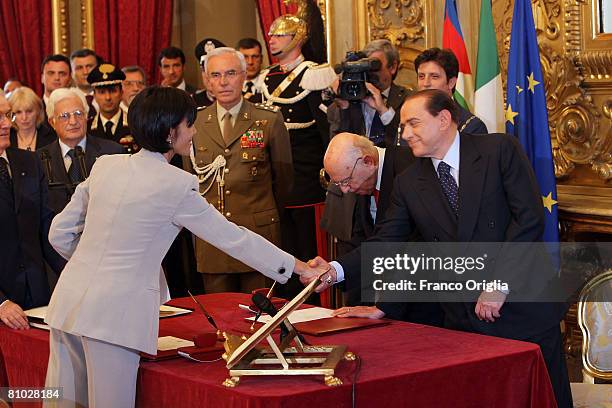 Newly appointed minister Mara Carfagna receives congratulations from Silvio Berlusconi at the end of the swearing in ceremony for the new Berlusconi...