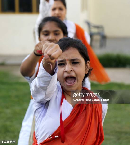 Hindu girls of the Durga Vahini, the 'saffron brigade' women's wing of the Hindu hardliner organization Vishwa Hindu Parishad , participate in a...